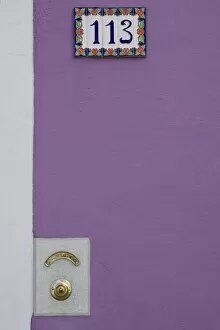 Images Dated 16th March 2005: Italy, Burano. Purple stucco wall with white tile house number and brass doorbell button