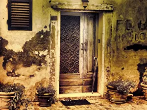 Italy, Chiusure. Infrared image of old door in typical buildings in the village Italy, Chiusure. Infrared image of old door in typical buildings in the village