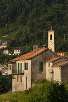 Como Province Prints: Italy, Como Province, Argegno. Mountainside church, sunrise