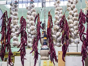 Images Dated 3rd January 2021: Italy, Florence. Garlic and peppers for sale hanging in a shop in the Central Market