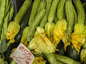 Images Dated 3rd January 2021: Italy, Florence. Zucchini with flowers for sale in the Central Market