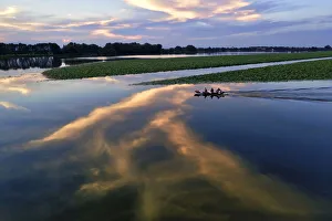 Navigation Prints: Italy, Mantova (Mantua). Sunset reflection and boat on lake