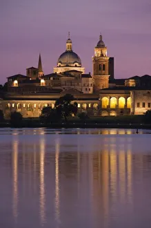 Italy, Mantua Province, Mantua. Town view and Palazzo Ducale from Lago Inferiore, dusk