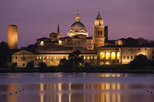 Italy, Mantua Province, Mantua. Town view and Palazzo Ducale from Lago Inferiore, dusk