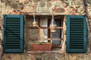 Bottle Prints: Italy, Monteriggioni. Stone wall, curtained window with blue shutters