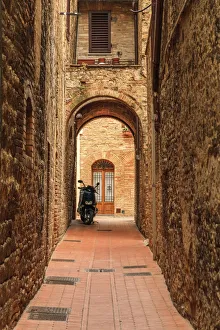 Alley Prints: Italy, San Gimignano. Alleyway with motorbike