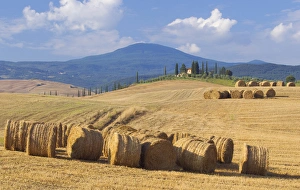 Bale Prints: Italy, San Quirico d Orcia. Bales of hay and farm house