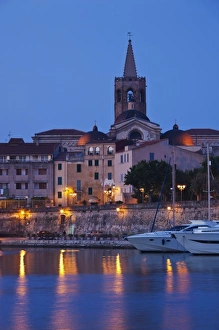 Images Dated 11th May 2009: Italy, Sardinia, Alghero. City walls from the yacht marina, dawn