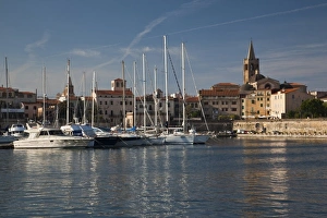 Images Dated 10th May 2009: ITALY, Sardinia, Alghero. City walls from the yacht marina, morning