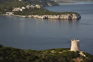 ITALY, Sardinia, Alghero. Spanish tower and Hotel Capo Caccia, late afternoon