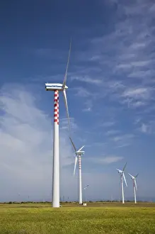 ITALY, Sardinia, Porto Torres. Wind farm and power plant