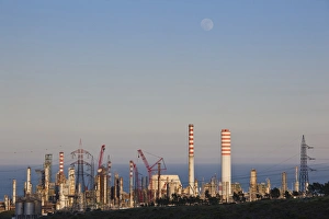 Images Dated 7th May 2009: ITALY, Sardinia, Sarroch. Porto Foxi oil refinery, sunset