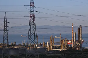 Images Dated 7th May 2009: ITALY, Sardinia, Sarroch. Porto Foxi oil refinery, sunset