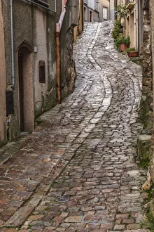 Images Dated 4th February 2020: Italy, Sicily, Palermo Province, Geraci Siculo. Winding narrow cobblestone street in