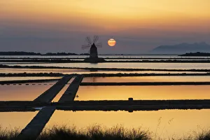 Italy, Sicily, Trapani Province, Marsala. Wind mills at the salt evaporation ponds in