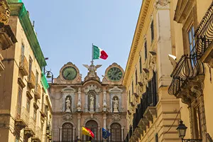 Italy, Sicily, Trapani Province, Trapani. Clock tower with the Italian flag in the city