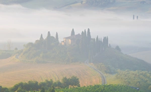 Gilles Delisle Prints: Italy, Tuscany. Belvedere house in morning fog