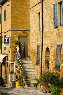 Prints of Italy, Tuscany. Brick building doorway Images Dated 2019 January: Italy, Tuscany. Brick building doorway