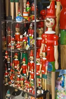Italy, Tuscany, Collodi. Pinocchio puppets in shop window