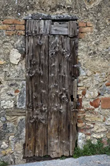 Images Dated 2022: Italy, Tuscany, Monteriggioni. Old doorway in the walled town of Monteriggioni