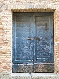 Images Dated 3rd January 2021: Italy, Tuscany. Old blue door with iron latch in a village in Tuscany