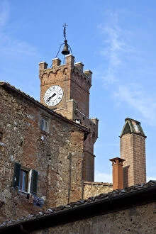 Italy, Tuscany, Pienza. The town hall clock tower in the town of Pienza