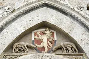 Wolf Prints: Italy, Tuscany, Sienna. Detail on Piazza del Campo showing a coat-of-arms and Romulus