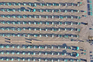 Italy, Tuscany, Torre del Lago Puccini, boathouse and neatly ordered beach chairs