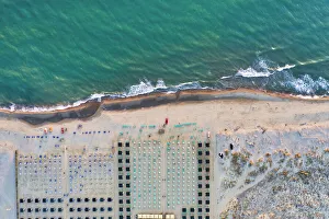 Images Dated 28th July 2020: Italy, Tuscany, Torre del Lago Puccini, boathouse and neatly ordered beach chairs