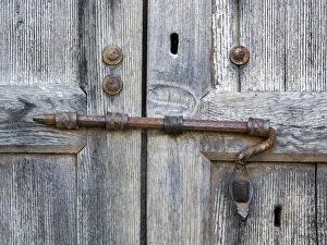 Unique Prints: Italy, Tuscany. Unique metal door lock on an old wooden door