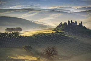 Italy, Tuscany, Val d Orcia. The Belvedere farmhouse at sunrise