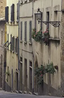 Street Light Prints: Italy, Tuscany, Volterra Geraniums and old houses on narrow street