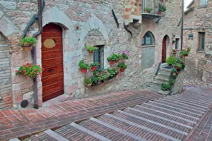 Umbria Prints: Italy, Umbria, Assisi. Walkway along the streets of Assisi lined with flowering pots