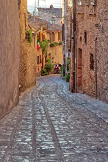 Umbria Prints: Italy, Umbria. Cobblestone street in the town of Spello