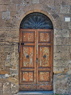 Umbria Prints: Italy, Umbria, Orvieto. Door along the street of town