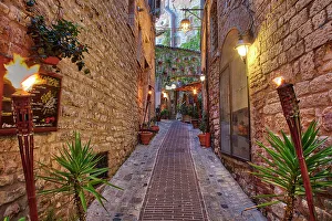 Umbria Prints: Italy, Umbria. Street lined with flower pots in the town of Assisi