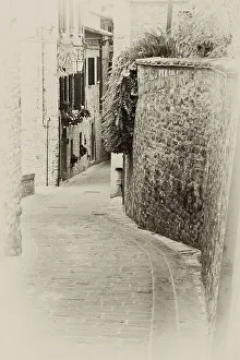 Umbria Prints: Italy, Umbria. Vintage look of a street in the historic town of Montone