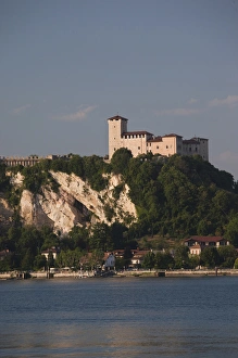 ITALY, Varese Province, Angera. La Rocca fortress from Arona, late afternoon