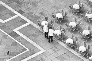 Pigeon Prints: Italy, Venice. Black and white looking down on waiters in San Marco Square from Campanile
