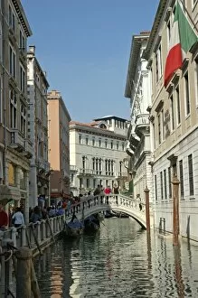 Italy, Venice, buildings and bridge on small canal
