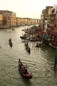 Images Dated 21st May 2011: Italy; Venice. The bustling riverfront along the Grand Canal in Venice at sunrise