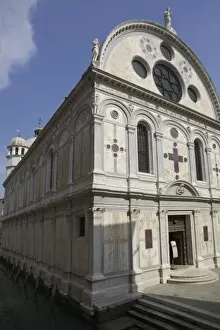 Italy, Venice. Church of Santa Maria dei Miracoli beside canal