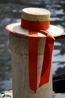 Ribbon Prints: Italy, Venice. Close-up of colorful gondoliers hat on piling