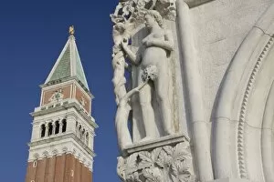 Italy, Venice. Corner statue of Doges Palace and Campanile