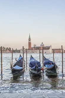Images Dated 2nd March 2020: Italy, Venice. Gondolas on the waterfront with San Giorgio Maggiore Church in