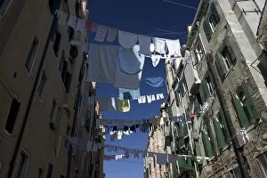 Italy, Venice. Laundry strung between buildings in the Ghetto