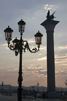Lincoln Peak Prints: Italy, Venice. Lion of St. Mark atop column and ornate lamp at sunrise
