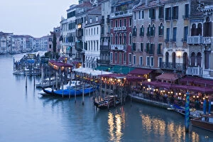 Italy, Venice. Outdoor dining along the Grande Canal by the Rialto Bridge