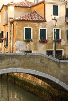 Riverfront Prints: Italy; Venice. A small bridge over a side canal in Venice