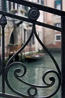 Metal Work Prints: Italy, Venice. Stair railing metalwork design frames canal with gondola